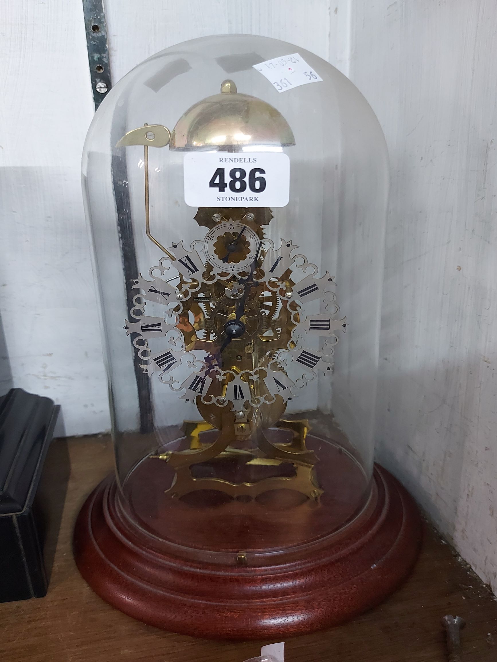 A modern Kieniger brass skeleton clock with decorative pierced dial and bell striking movement,