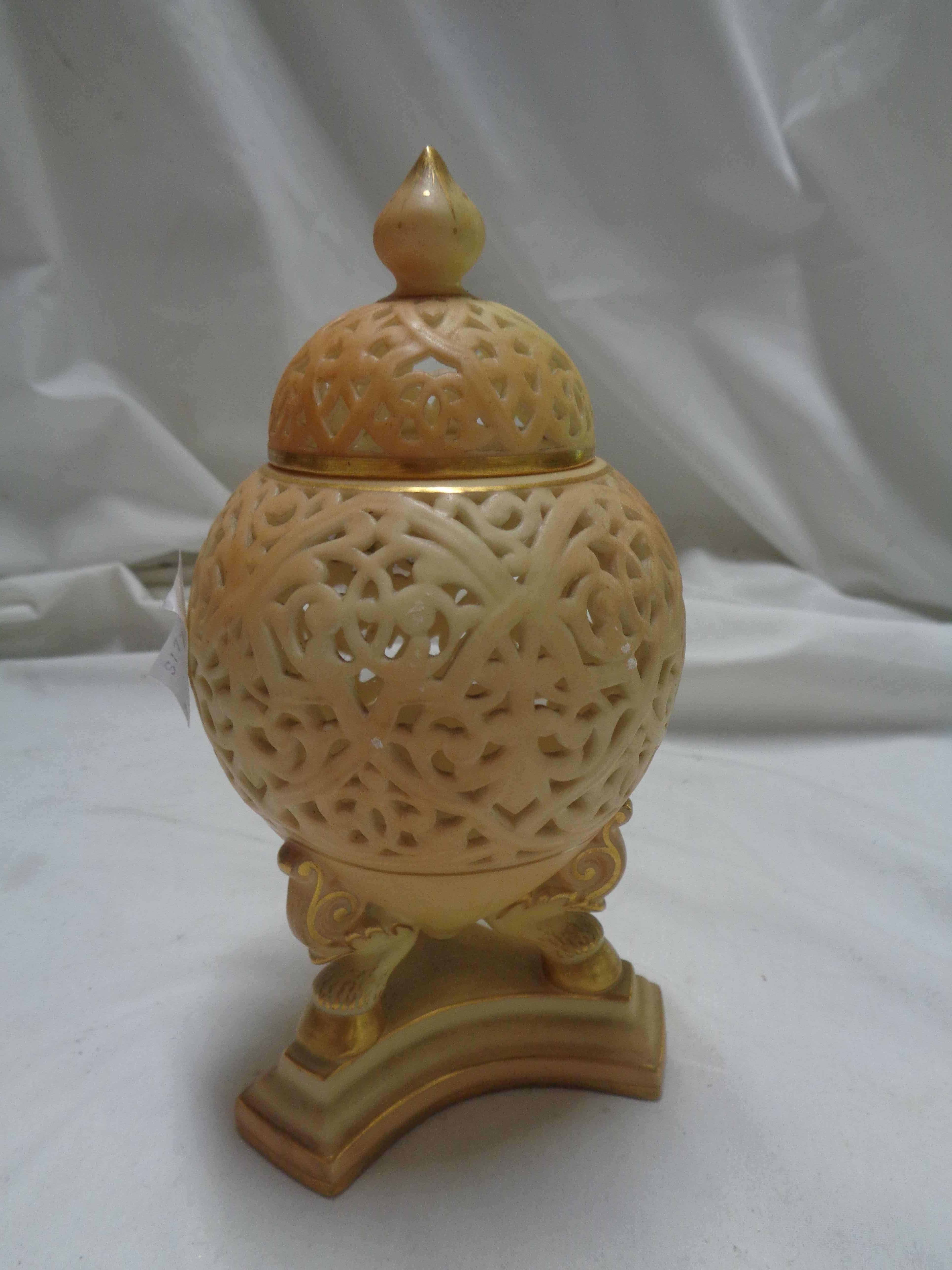 An early 20th Century Grainger's Worcester porcelain pot pourri of urn form with a trefoil base