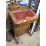 A 54cm Victorian inlaid figured walnut Davenport with galleried lift-top pen tray and replacement