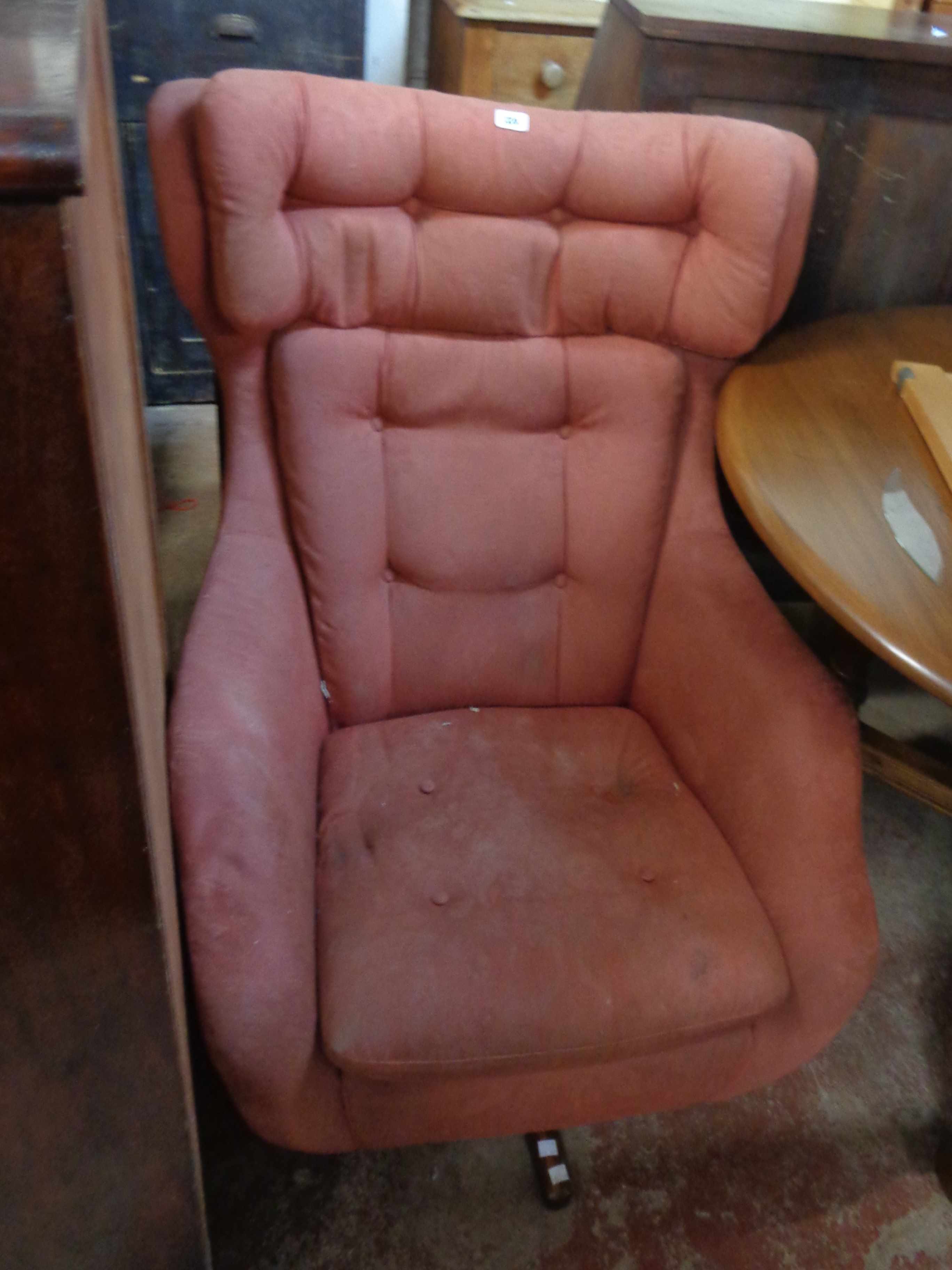 A vintage Parker Knoll 'Statesman' armchair chair with original dusky pink button back upholstery,