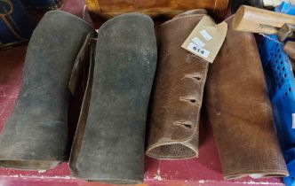 Two pairs of old leather gaiters one black, one brown