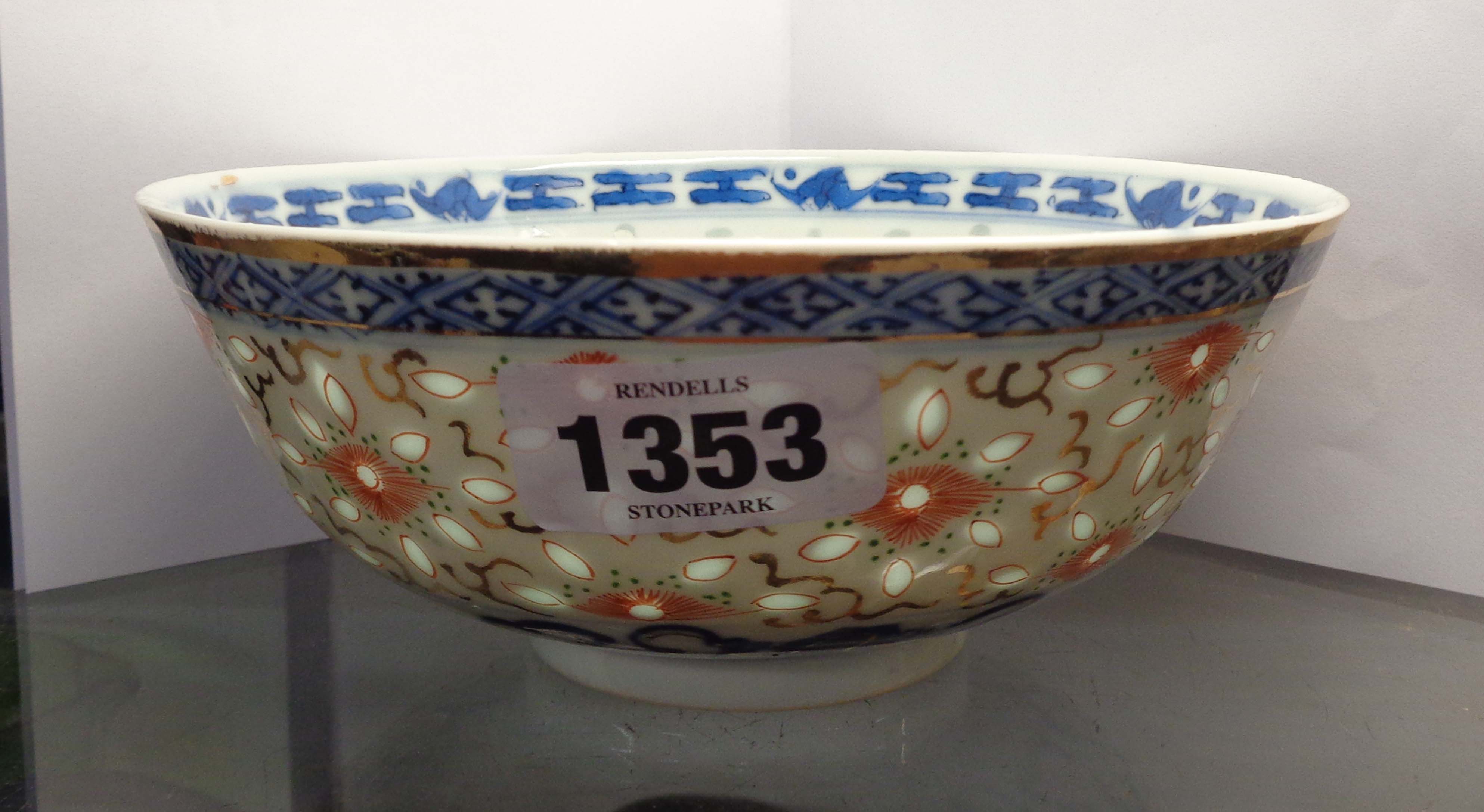 A Chinese porcelain bowl with `rice wind A Chinese porcelain bowl with 'rice windows' and hand