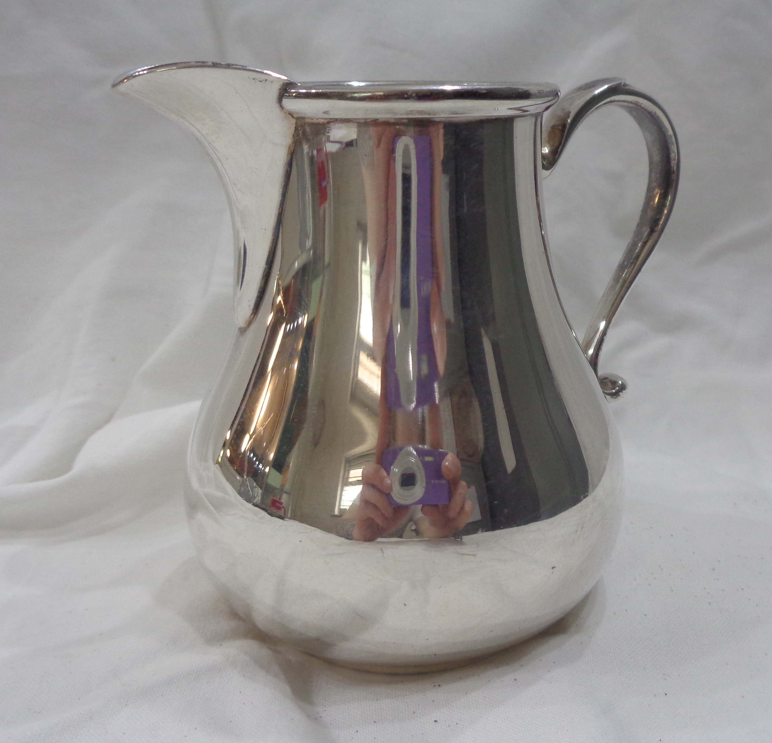 A vintage George Tarratt silver cream jug of classic baluster form - base marked - London 1967