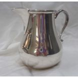 A vintage George Tarratt silver cream jug of classic baluster form - base marked - London 1967