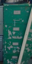 A green painted metal filing cabinet