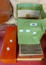 A green bag containing vintage food tins - sold with an old Treasury of Music book, etc.