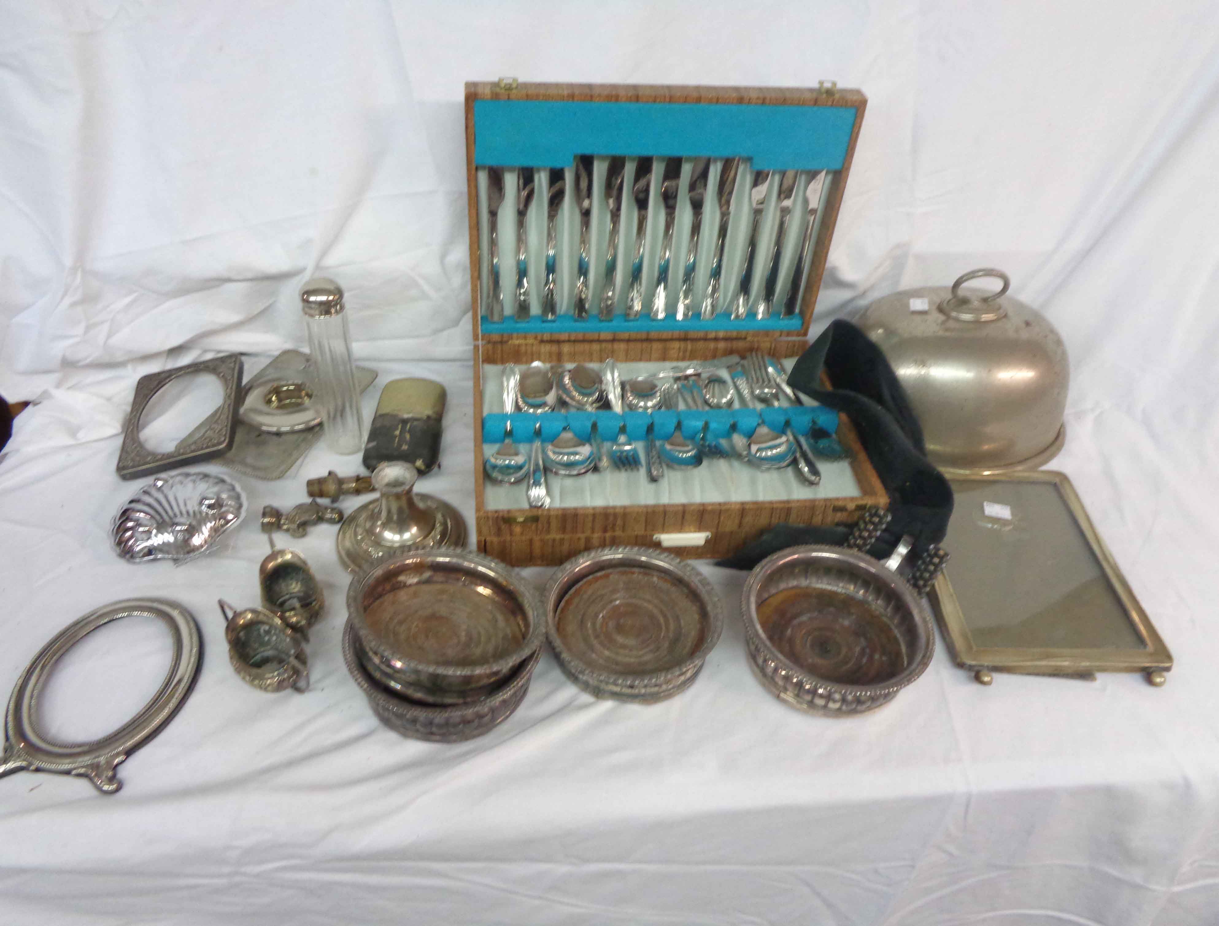 A box containing a quantity of silver plated items including a canteen of stainless steel cutlery,