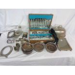 A box containing a quantity of silver plated items including a canteen of stainless steel cutlery,