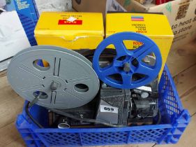 A vintage Raynox reel-to-reel projector and Kodak XL33 Movie camera