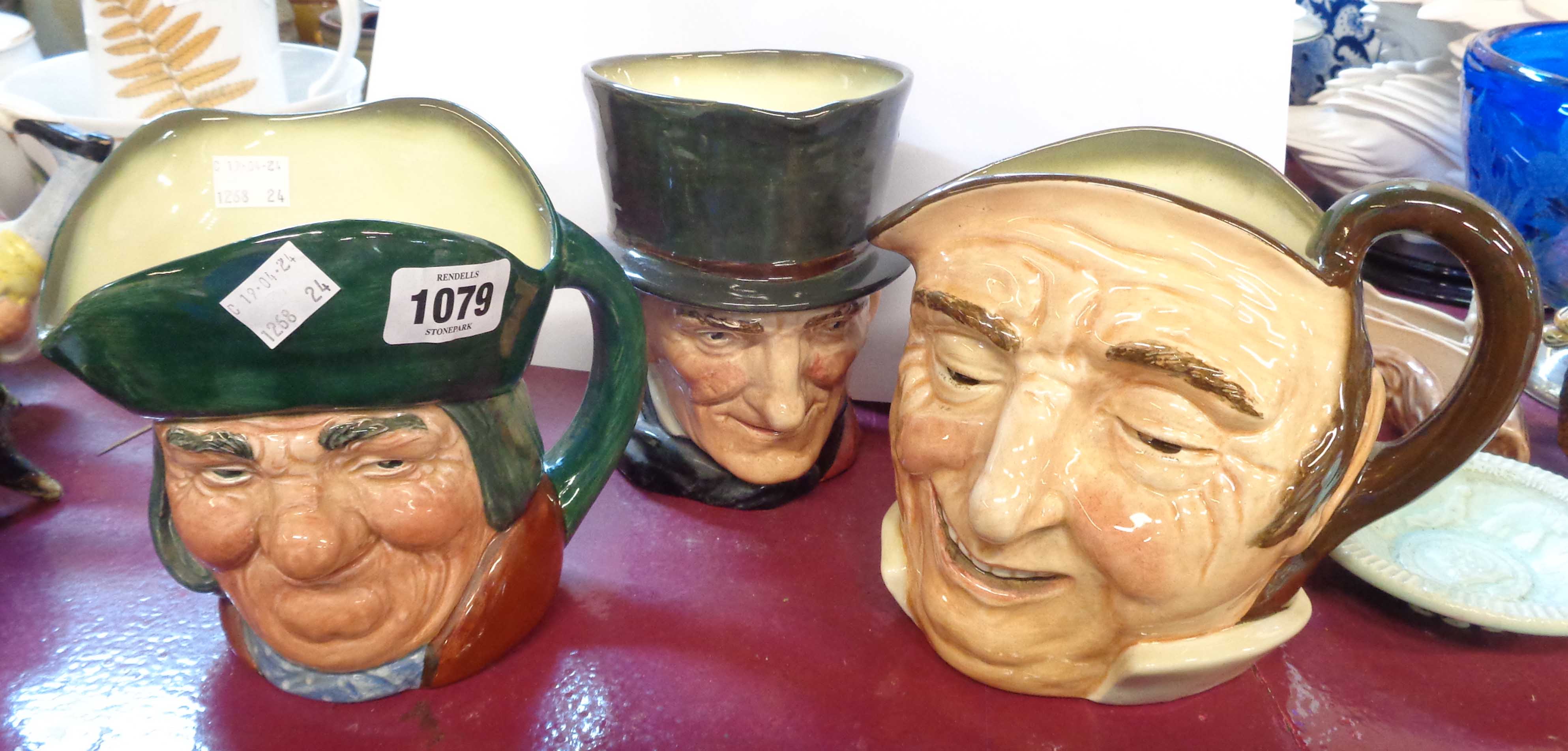 Three large Royal Doulton character jugs comprising 'Toby Philpotts', 'Farmer John' and 'John Peel'