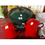 A green enamelled bread bin - sold with two red enamelled coffee pots