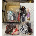 A small black case containing vintage Cimely dolls and accessories