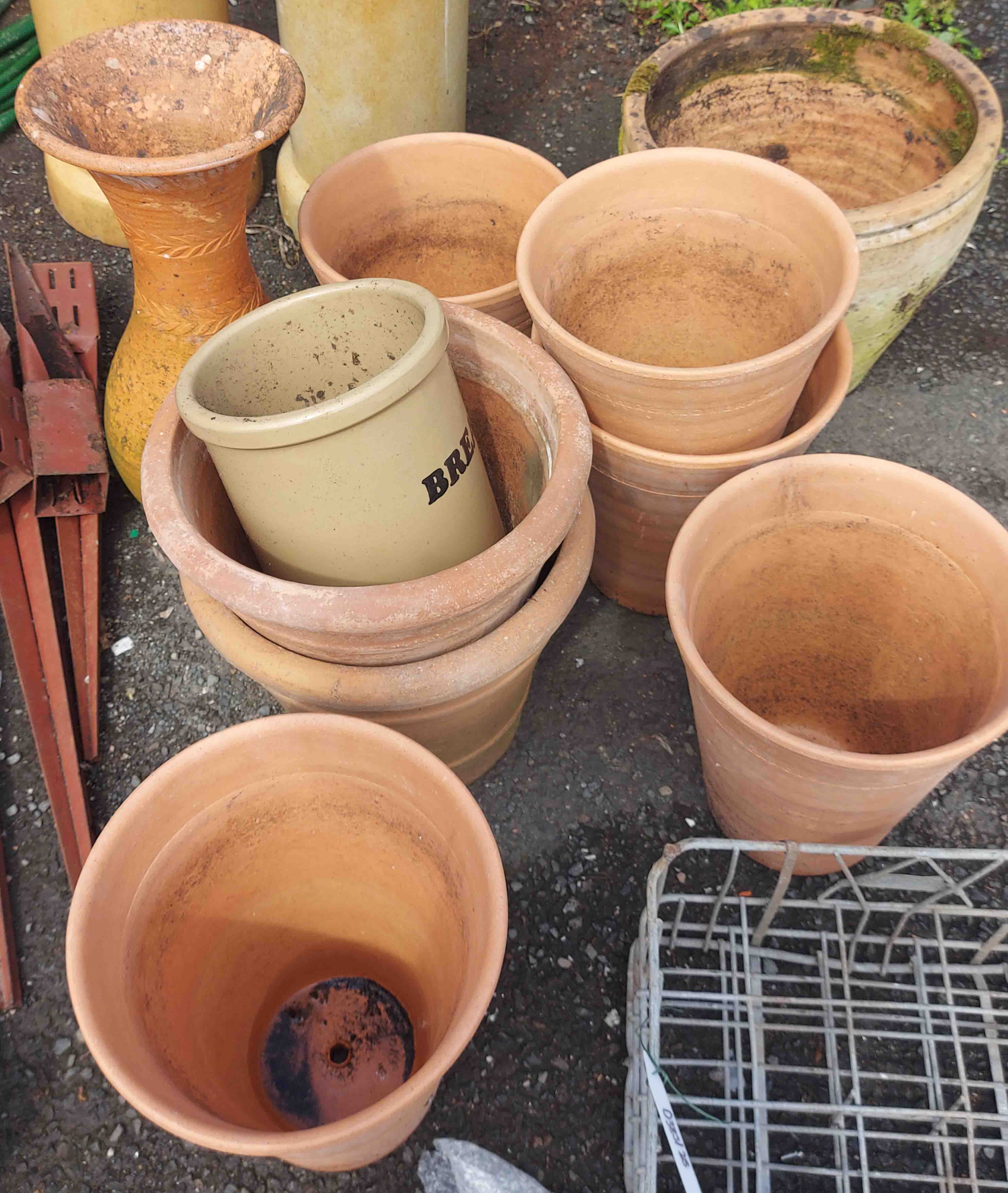 Seven terracotta pots, a large vase (a/f), and a bread crock without lid