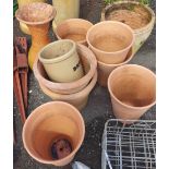 Seven terracotta pots, a large vase (a/f), and a bread crock without lid