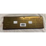 A brass mounted wooden cribbage board