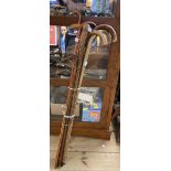 Nine vintage wooden walking sticks of various form