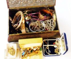A vintage bombe biscuit tin containing a quantity of assorted costume jewellery and other items