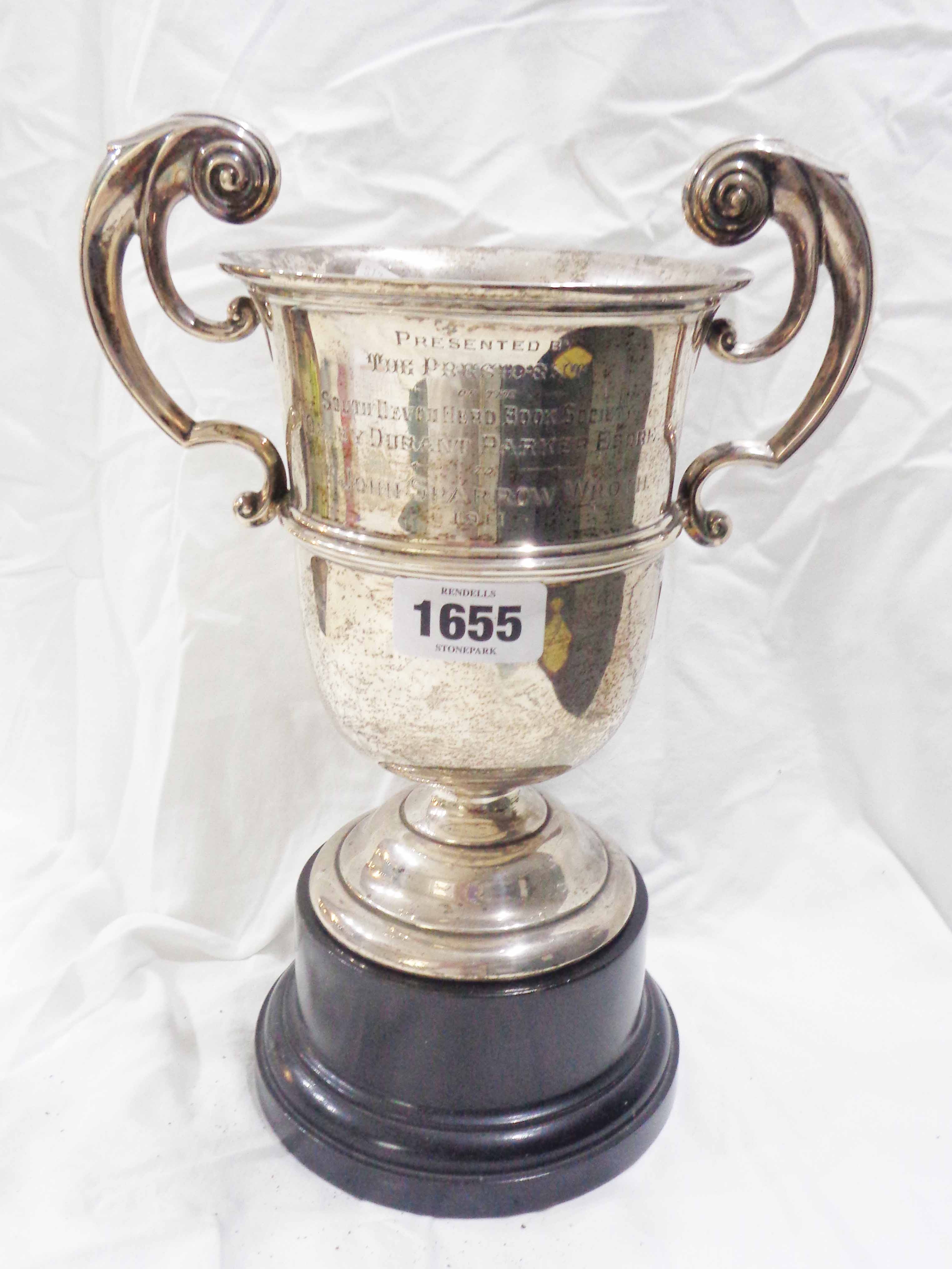 A 22cm high Walker & Hall silver trophy cup with flanking acanthus scroll handles with 'South