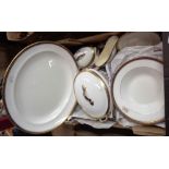 A box containing a quantity of George Jones bone china dinner ware, decorated with a simple gilt and