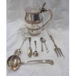 A silver ladle, four small silver spoons and a butter knife - sold with a silver plated copper