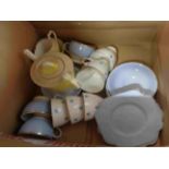 A box containing a quantity of ceramics