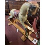 A large vintage Haddon rocking horse on safety rocker base