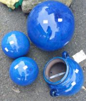 Three ceramic balls - sold with a blue pot