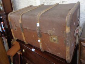 An 82cm vintage cane bound and weather coated travelling trunk with original lift-out tray and