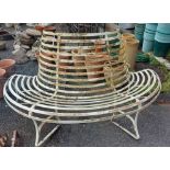 A two part wrought iron circular tree bench