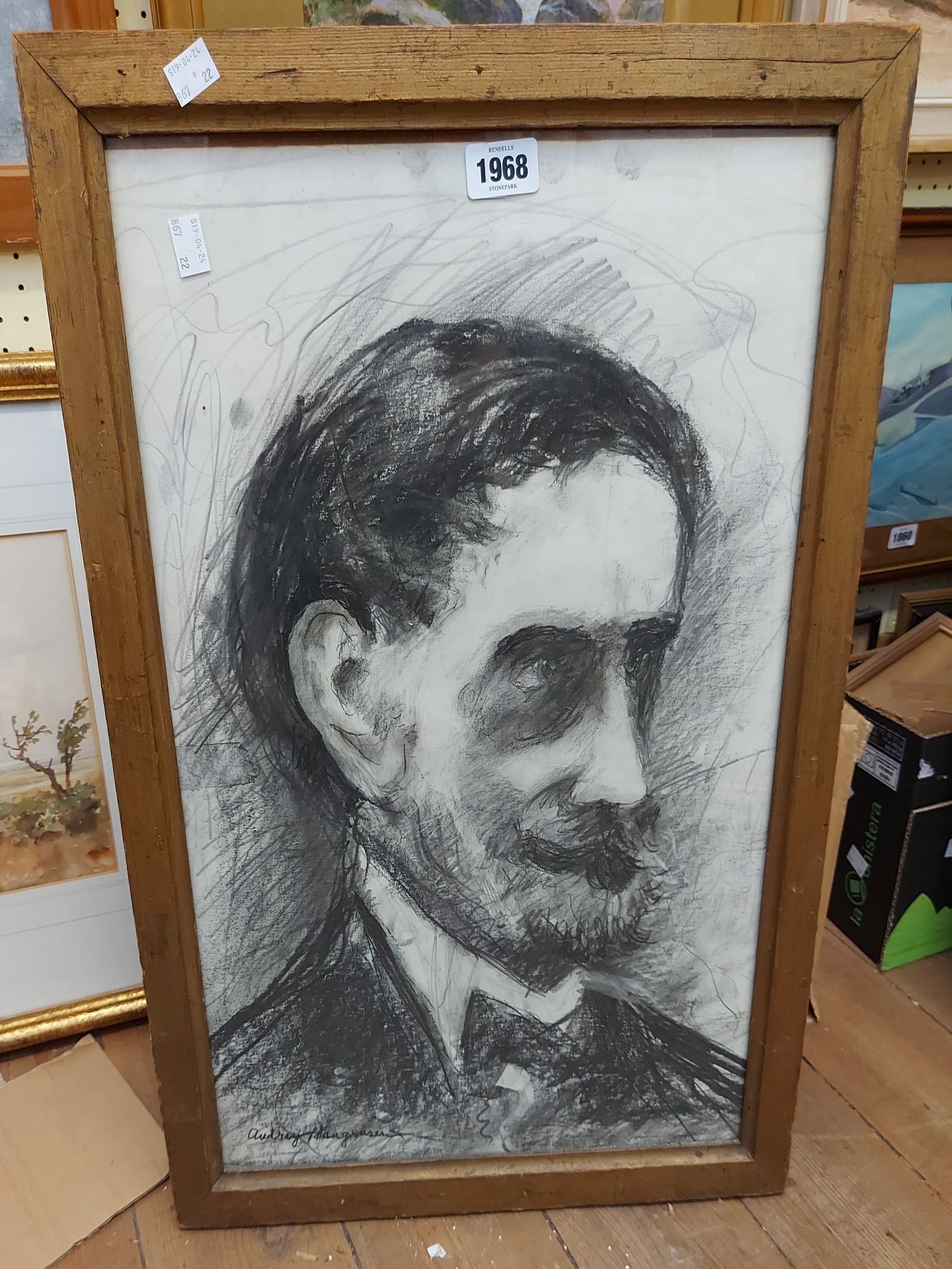 A framed charcoal and pencil drawing head and shoulders portrait of a gentleman with moustache -