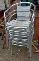 A set of six aluminium stacking chairs