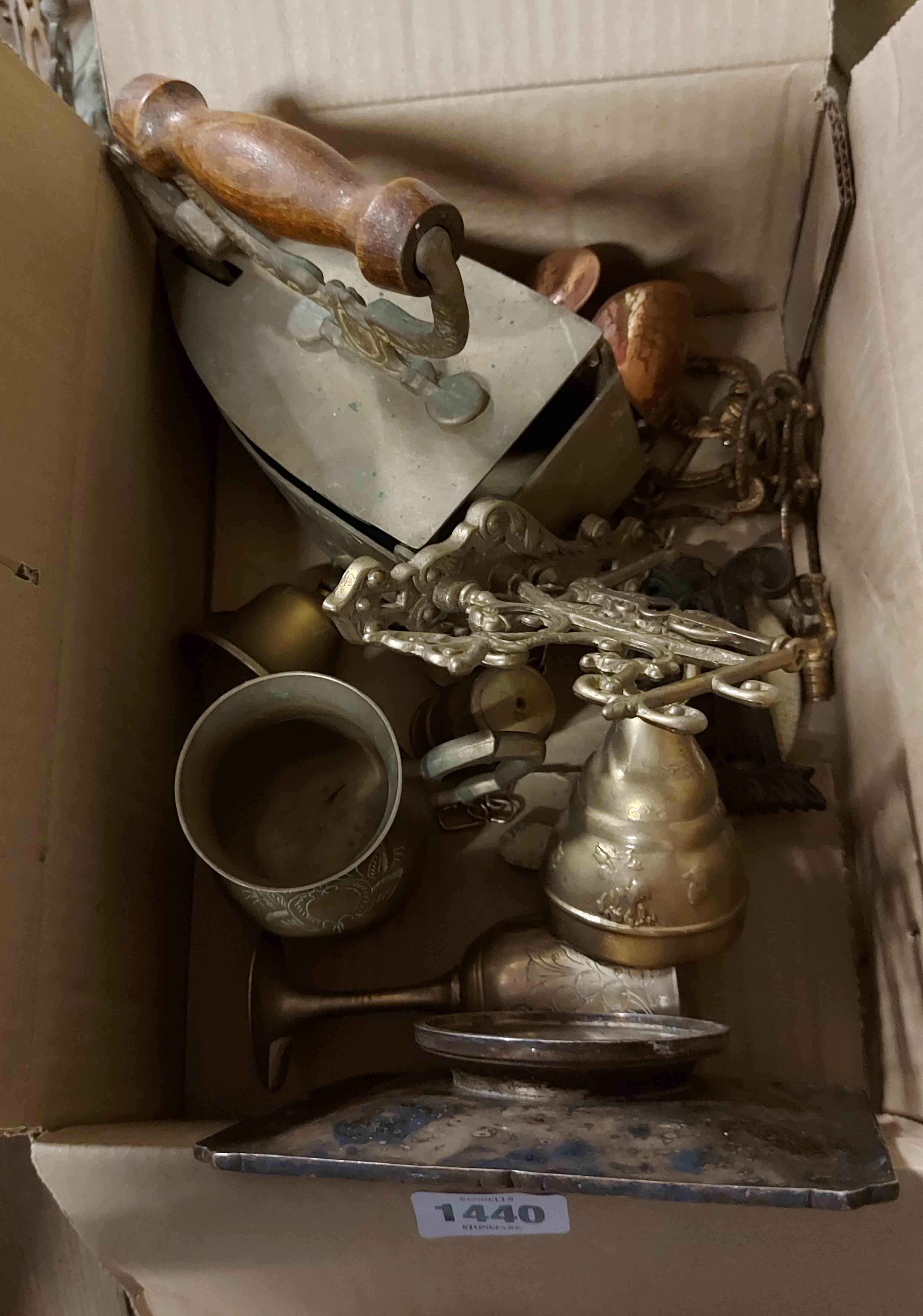 A box containing a quantity of metalware including brass wall bell, slug iron, etc.