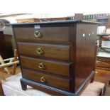 A pair of Stag Minstrel three drawer bedside chests