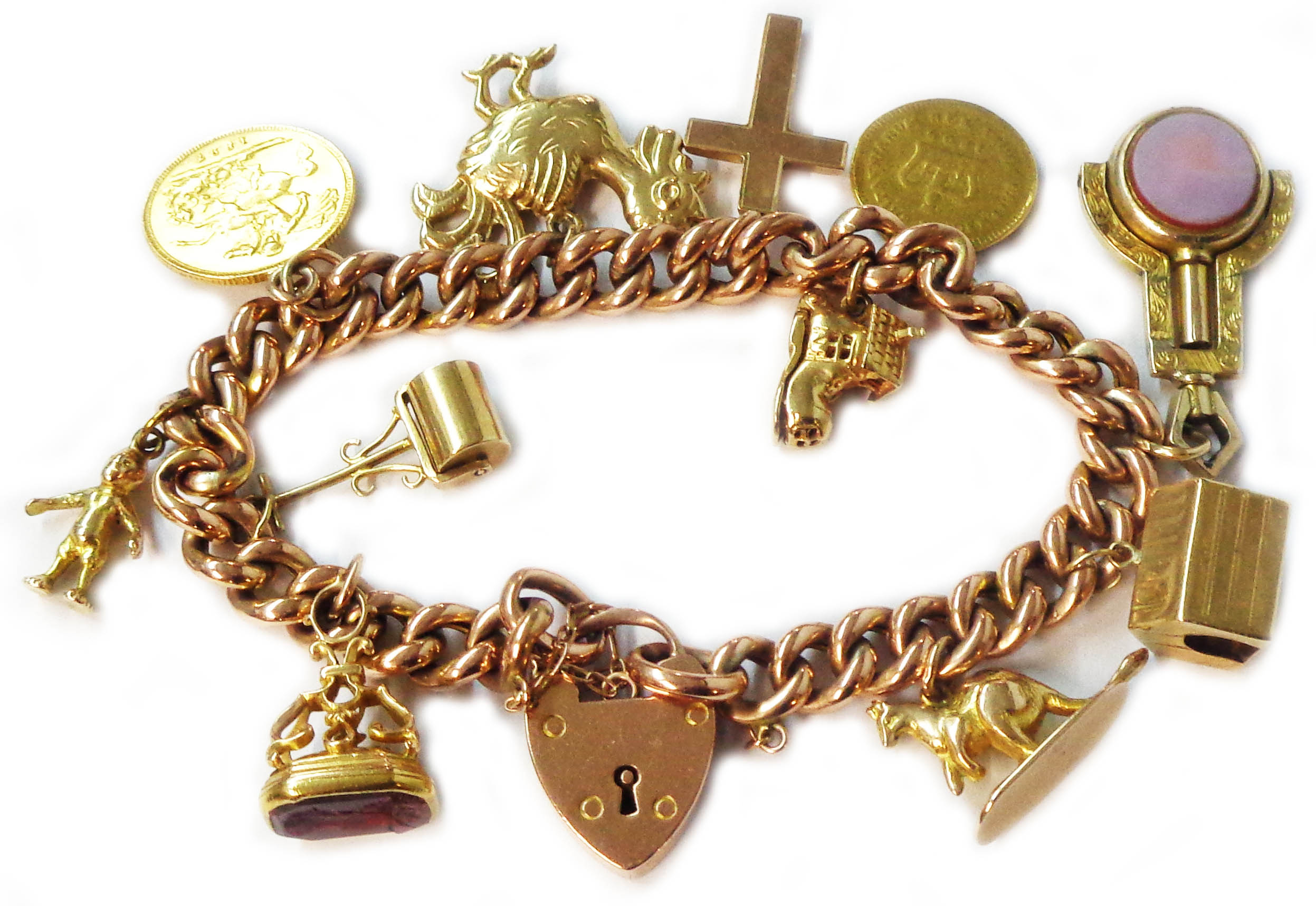 A marked 9c rose metal kerb-link charm bracelet with 375 (9ct.) heart shaped locket and set with