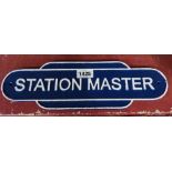 A modern cast iron Station Master sign