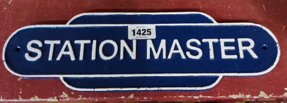 A modern cast iron Station Master sign