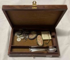 A small box containing two silver teaspoons, silver 3d, 6d, Shilling, etc.