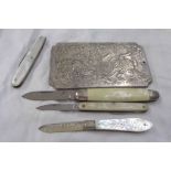 A silver folding fruit knife with mother-of-pearl clad handle, three vintage penknives and a Chinese