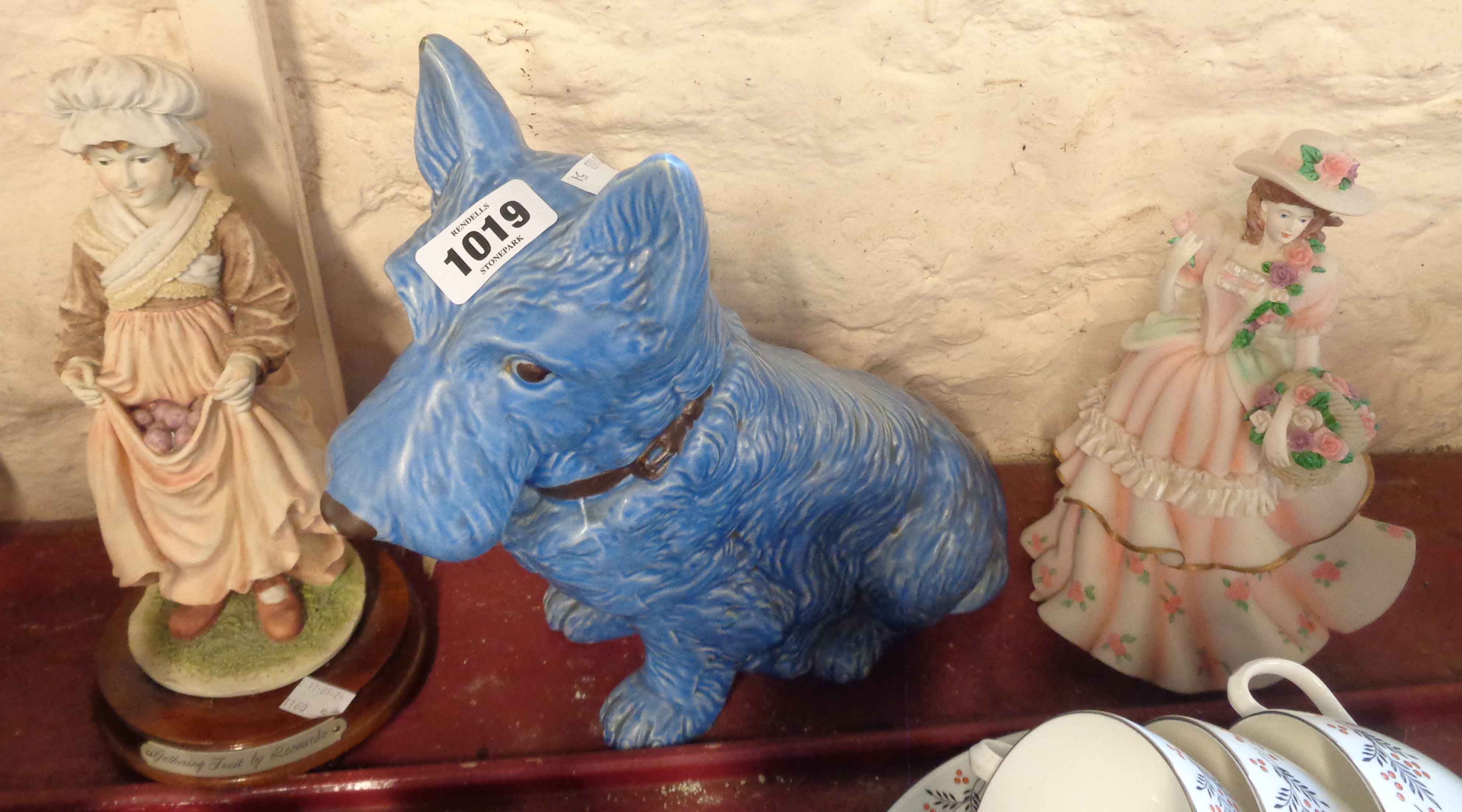 A large SylvaC pottery terrier figurine with blue glaze finish - sold with two resin figurines