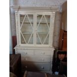 A 1.28m antique painted pine two part dresser with shelves enclosed by a pair of beaded glazed panel