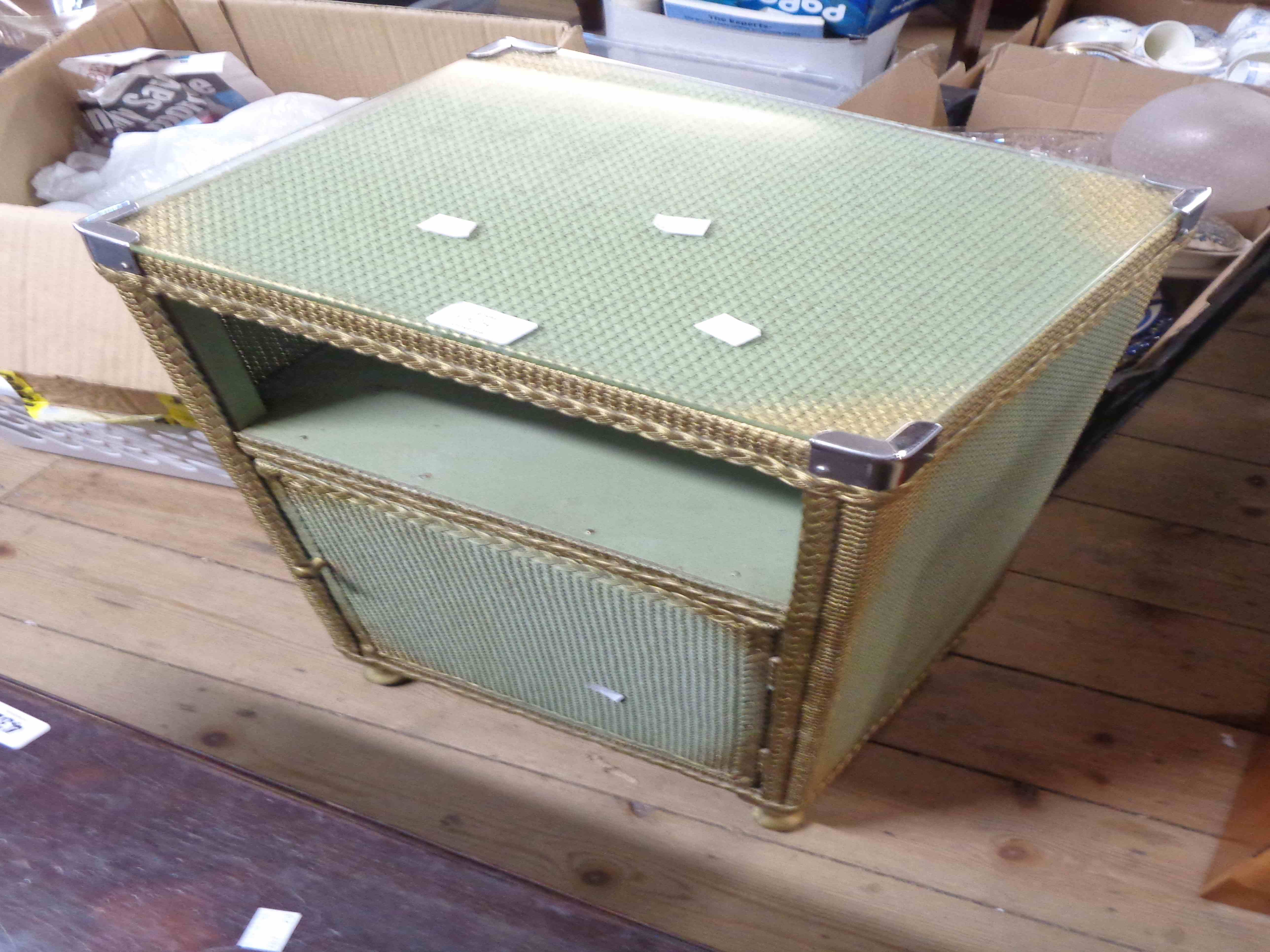 A vintage loom style bedside cabinet with glass top, recess and single door under - sold with a