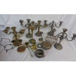 A box containing a quantity of silver plated items including candlesticks, teaware, etc.