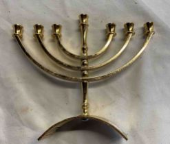 A modern Karshi gold plated Menorah (candle holder)