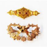 An early 20th Century 375 (9ct.) rose gold bow and floral swag pattern brooch - sold with a marked