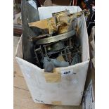 A box containing a quantity of assorted clock parts including gilt spelter case, part movements,