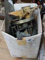 A box containing a quantity of assorted clock parts including gilt spelter case, part movements,
