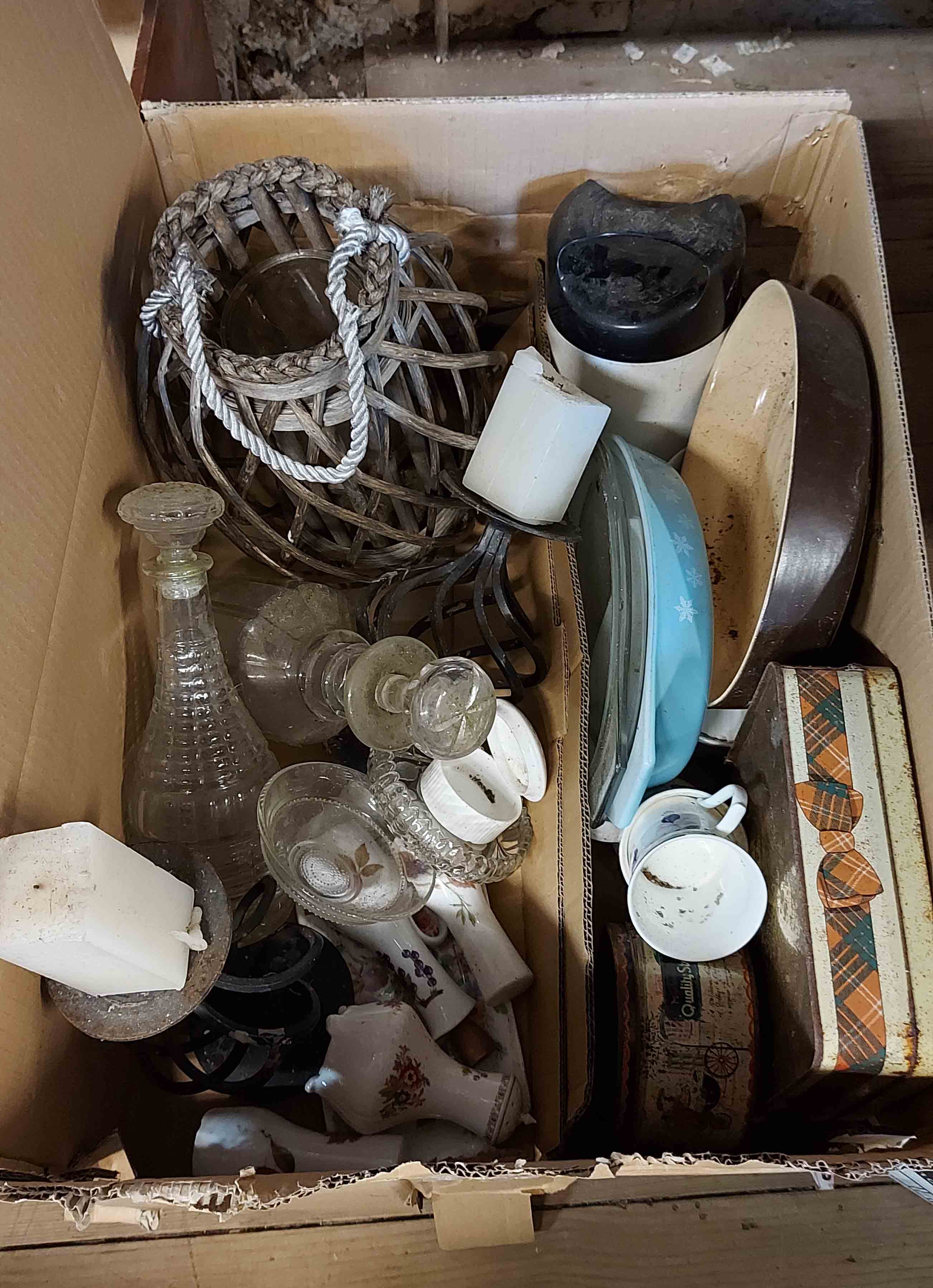 A box containing a quantity of kitchenware including glass decanters, candle lantern, etc.