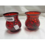 A pair of Venitian ruby glass vases with painted silver lustre decoration