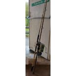 A Sea Ray fishing rod - sold with a boat rod and a box containing a quantity of fishing tackle,