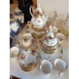 A Royal Albert bone china tea set decorated in the Old Country Roses pattern comprising teapot,